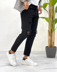 JEANS NERO CON ROTTURE SDL OUTFIT